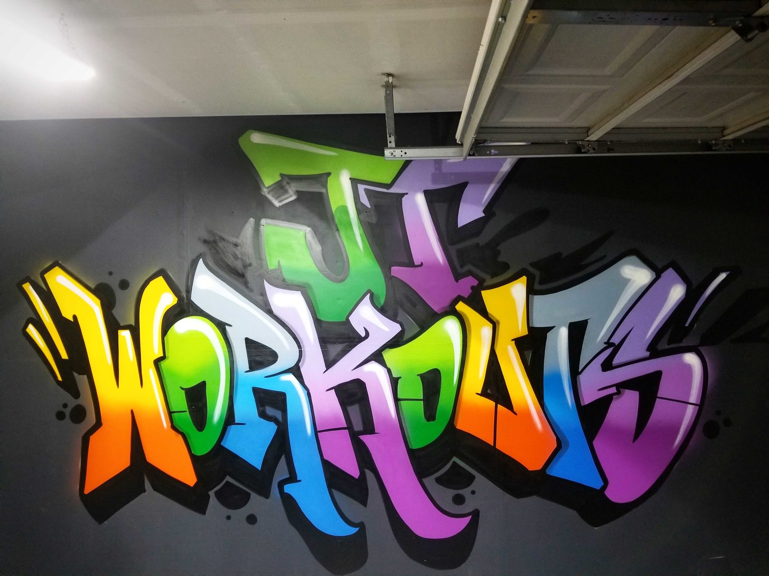 Graffiti mural in a garage for a personal trainer