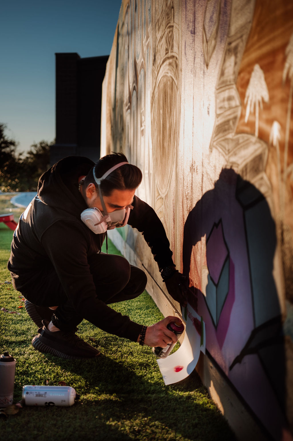 Snuk One painting Santiago's Mural stencil on wall